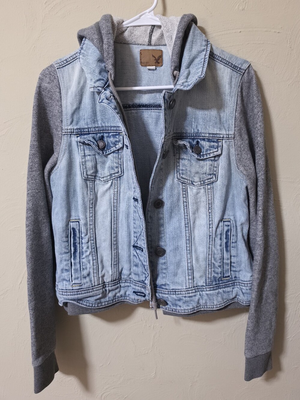 American Eagle Light Wash Denim Hooded Jacket with Gray Knit Sleeves